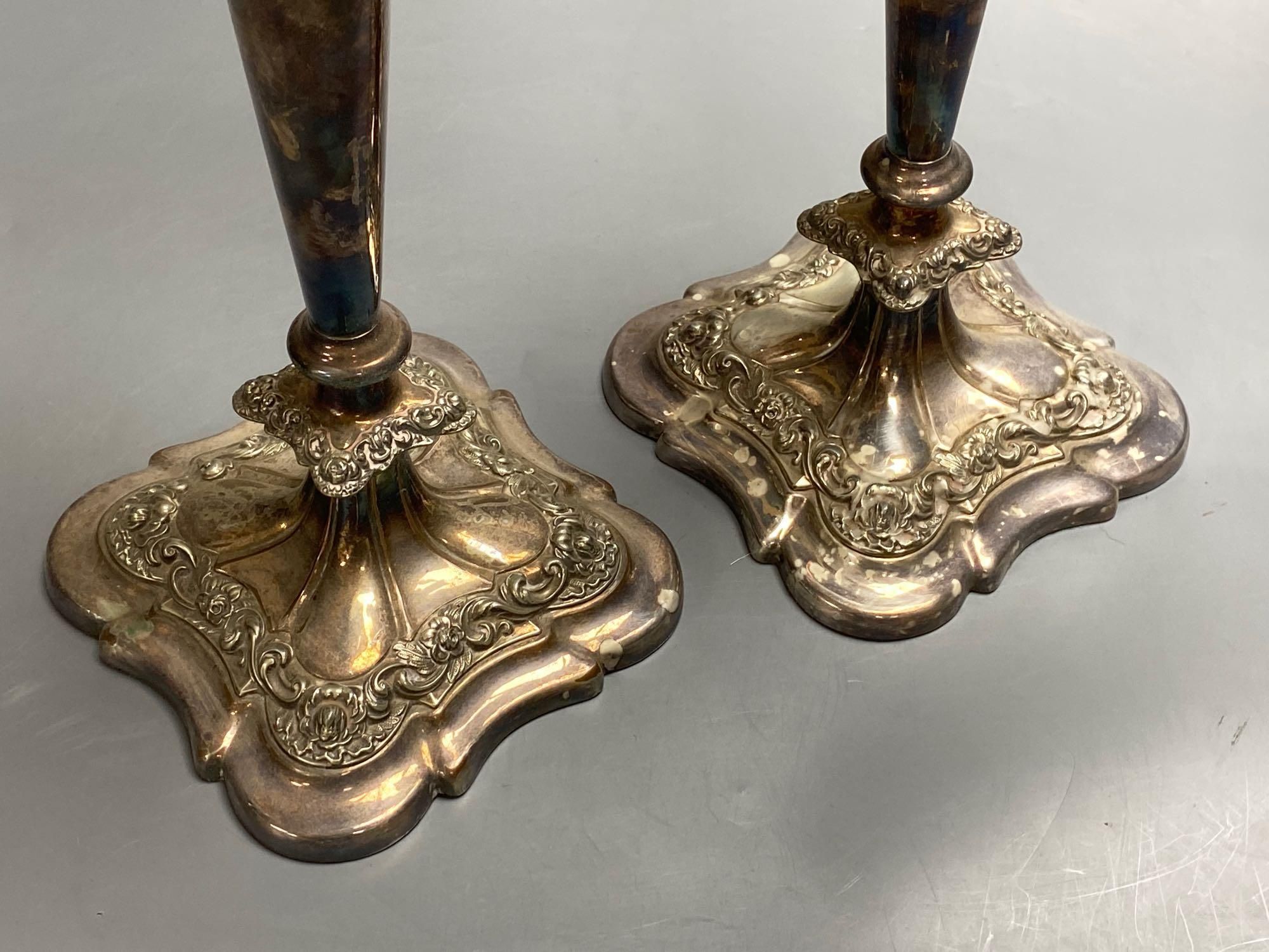 A pair of silver plated candelabra, three sconce candelabra, 51cm